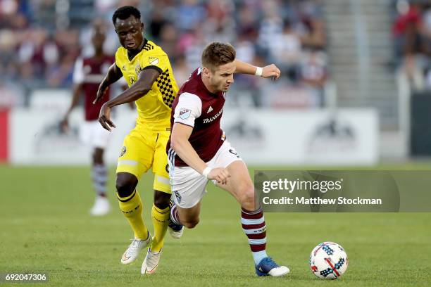 Mohammed Abu of the Columbus Crew SC knocks down Kevin Doyle of the Colorado Rapids at Dick's Sporting Goods Park on June 3, 2017 in Commerce City,...