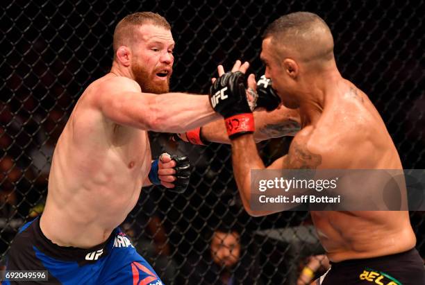 Nate Marquardt punches Vitor Belfort of Brazil in their middleweight bout during the UFC 212 event at Jeunesse Arena on June 3, 2017 in Rio de...