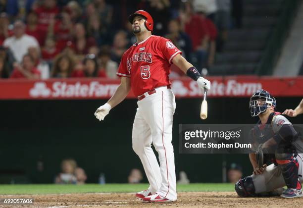 Albert Pujols of the Los Angeles Angels of Anaheim watches as his career home run number 600 clears the wall, a grand slam in the fourth inning...