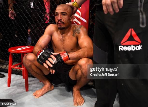 Jose Aldo of Brazil reacts after his TKO loss to Max Holloway in their UFC featherweight championship bout during the UFC 212 event at Jeunesse Arena...