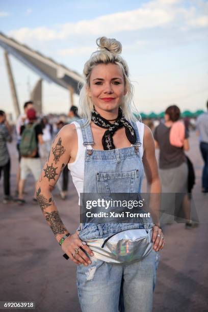 Manon is wearing Zara's jean dungarees, Pull&Bear top and Timberland boots during Primavera Sound 2017 on June 3, 2017 in Barcelona, Spain.