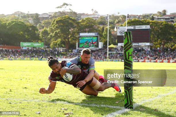 Jorge Taufua of the Sea Eagles scores a try during the round 13 NRL match between the Manly Sea Eagles and the Canberra Raiders at Lottoland on June...