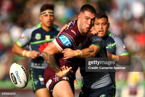 Curtis Sironen of the Sea Eagles loses the ball in a tackle during the round 13 NRL match between the Manly Sea Eagles and the Canberra Raiders at...