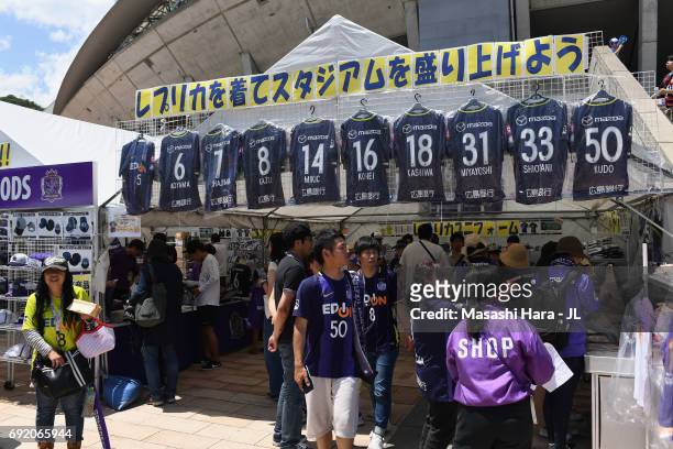 Sanfrecce Hiroshima supporters check an official marchandise stall prior to the J.League J1 match between Sanfrecce Hiroshima and Kashima Antlers at...
