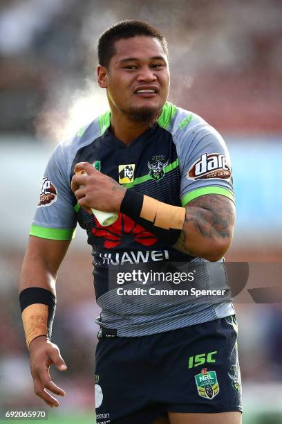 Joseph Leilua of the Raiders sprays himself during the round 13 NRL match between the Manly Sea Eagles and the Canberra Raiders at Lottoland on June...