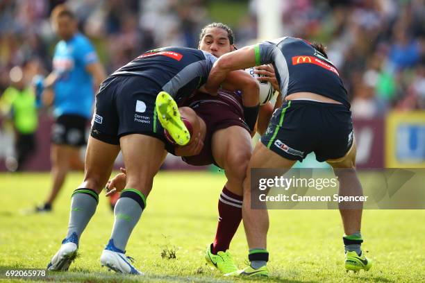 Martin Taupau of the Sea Eagles is tackled during the round 13 NRL match between the Manly Sea Eagles and the Canberra Raiders at Lottoland on June...