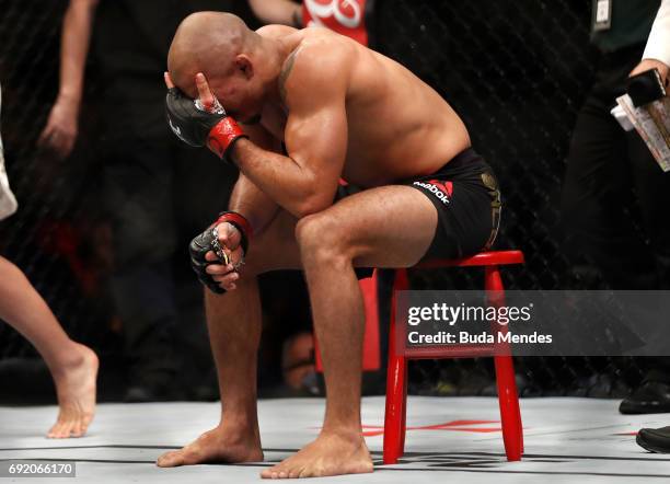 Jose Aldo of Brazil reacts after his TKO loss to Max Holloway in their UFC featherweight championship bout during the UFC 212 event at Jeunesse Arena...