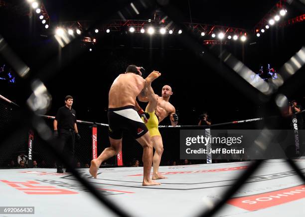 Marlon Moraes kicks Raphael Assuncao of Brazil in their bantamweight bout during the UFC 212 event at Jeunesse Arena on June 3, 2017 in Rio de...