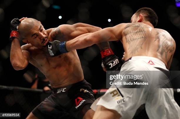 Max Holloway punches Jose Aldo of Brazil in their UFC featherweight championship bout during the UFC 212 event at Jeunesse Arena on June 3, 2017 in...