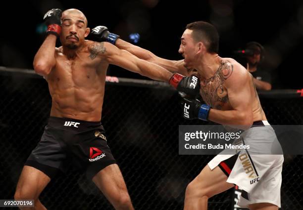 Max Holloway punches Jose Aldo of Brazil in their UFC featherweight championship bout during the UFC 212 event at Jeunesse Arena on June 3, 2017 in...