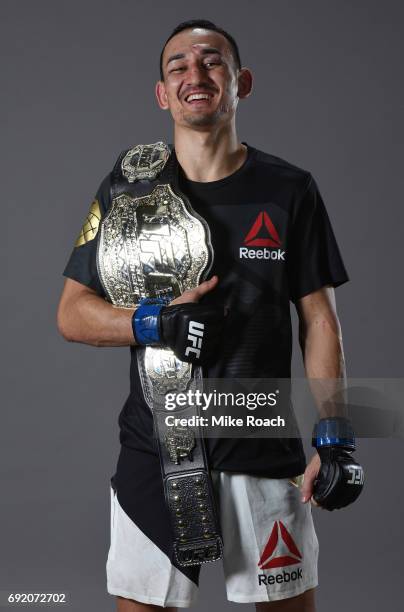 Max Holloway poses for a portrait backstage after his TKO victory over Jose Aldo during the UFC 212 event at Jeunesse Arena on June 3, 2017 in Rio de...