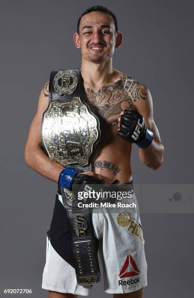 Max Holloway poses for a portrait backstage after his TKO victory over Jose Aldo during the UFC 212 event at Jeunesse Arena on June 3, 2017 in Rio de...