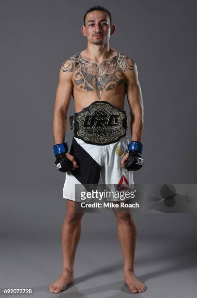 Max Holloway poses for a portrait backstage after his TKO victory over Jose Aldo during the UFC 212 event at Jeunesse Arena on June 3, 2017 in Rio de...