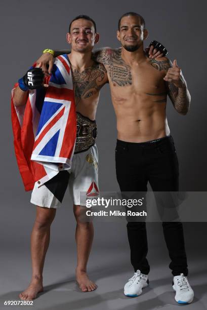 Max Holloway poses for a portrait backstage with fellow Hawaiian Yancy Medeiros after his TKO victory over Jose Aldo during the UFC 212 event at...