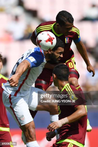 Defender Cameron Carter-Vickers and Venezuela's midfielder Yangel Herrera fight for the ball, as Venezuela's defender Ronald Hernandez watches,...