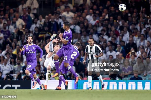 Mario Mandzukic of Juventus scores first goal during the UEFA Champions League Final match between Real Madrid and Juventus at the National Stadium...