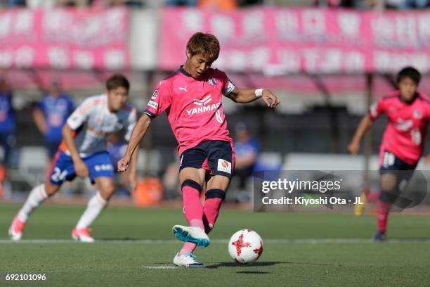 Yoichiro Kakitani of Cerezo Osaka converts the penalty to score the opening goal during the J.League J1 match between Cerezo Osaka and Albirex...