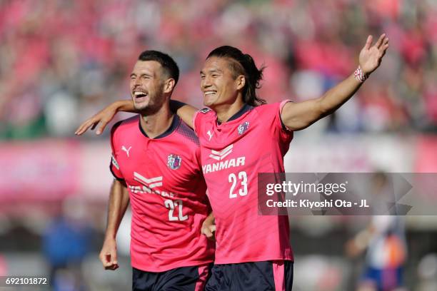 Tatsuya Yamashita of Cerezo Osaka celebrates scoring his side's second goal with his team mate Matej Jonjic during the J.League J1 match between...