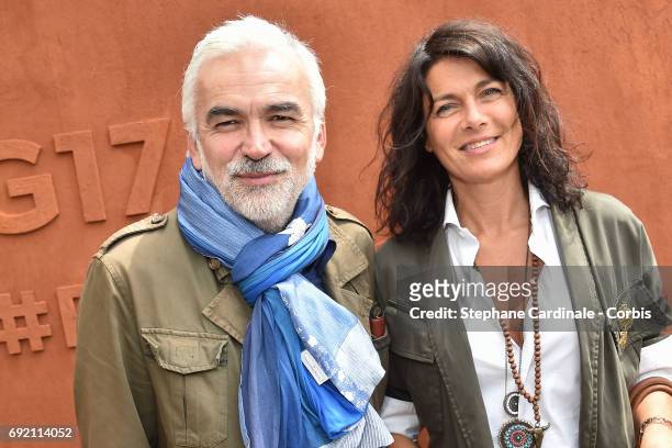 Journalist Pascal Praud and his wife attend the 2017 French Tennis Open - Day Seven at Roland Garros on June 3, 2017 in Paris, France.
