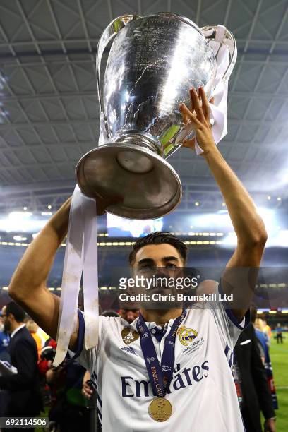 Enzo Fernandez of Real Madrid, son of coach Zinedine Zidane, lifts the trophy following the UEFA Champions League Final match between Juventus and...