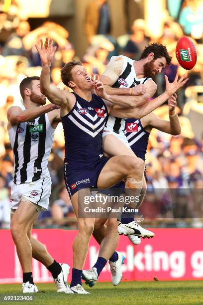 Matt Taberner of the Dockers spills a mark against Tyson Goldsack of the Magpies during the round 11 AFL match between the Fremantle Dockers and the...