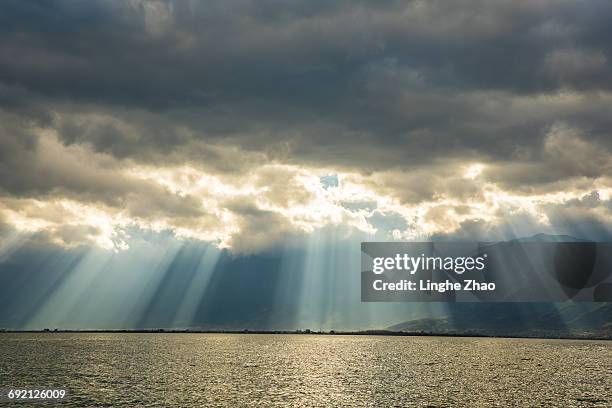 sunset at lake - linghe zhao stock pictures, royalty-free photos & images