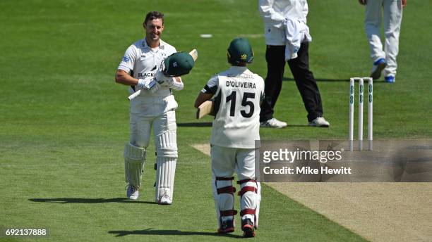 Daryl Mitchell of Worcestershire is congratulated by his opening partner Brett D'Oliveira after reaching his century during the third day of the...