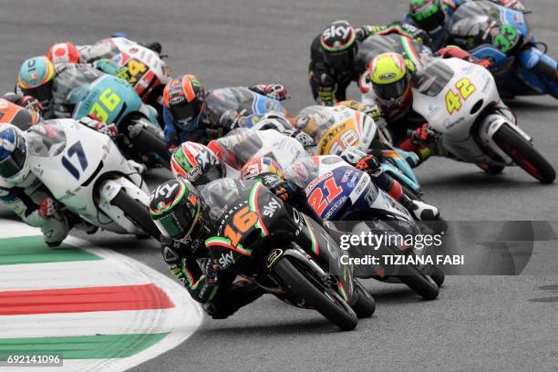 Sky Racing Team VR46 rider Italian Andrea Migno leads the Moto3 Grand Prix at the Mugello race track on June 4, 2017. Sky Racing Team VR46 rider...