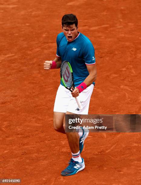 Milos Raonic of Canada celebrates winning the first set during the mens singles fourth round match against Pablo Carreno Busta of Spain on day eight...