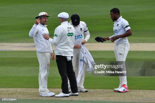 Sussex captain Chris Adams remonstrates with umpire Neil Mallender after an lbw decision against batsman Brett D'Oliveira was revoked during the...