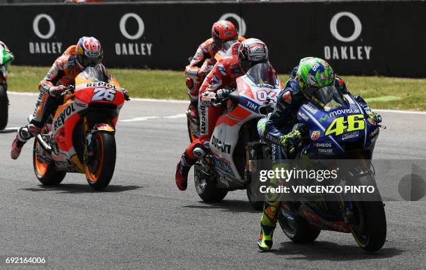 Movistar Yamaha MotoGP rider Italian Valentino Rossi , Ducati's Team rider Italian Andrea Dovizioso and Repsol Honda Team rider Spanish Dani Pedrosa...