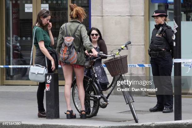 Group of young women at London Bridge following last night's terroris attack on June 4, 2017 in London, England. Police continue to cordon off an...