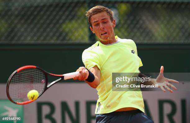 Matteo Martineau of France plays a forehand during the boys singles first round match against Juan Pablo Grassi Mazzuchi of Argentina on day eight of...