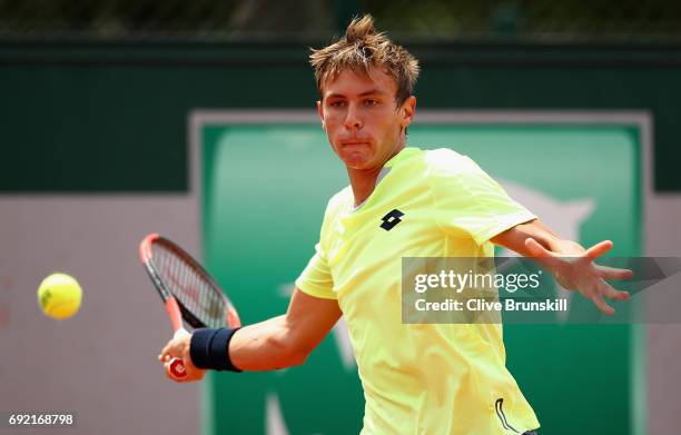 Matteo Martineau of France plays a forehand during the boys singles first round match against Juan Pablo Grassi Mazzuchi of Argentina on day eight of...