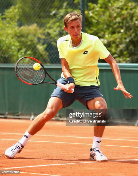 Matteo Martineau of France plays a forehand during the boys singles first round match against Juan Pablo Grassi Mazzuchi of Argentina on day eight of...