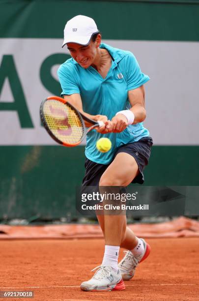 Juan Pablo Grassi Mazzuchi of Argentina plays a forehand during the boys singles first round match against Matteo Martineau of France on day eight of...