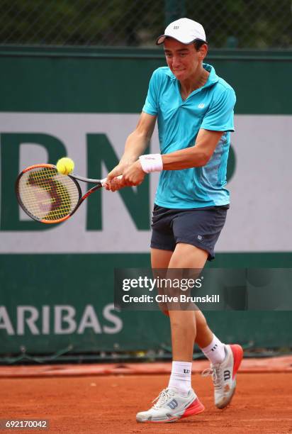 Juan Pablo Grassi Mazzuchi of Argentina plays a forehand during the boys singles first round match against Matteo Martineau of France on day eight of...