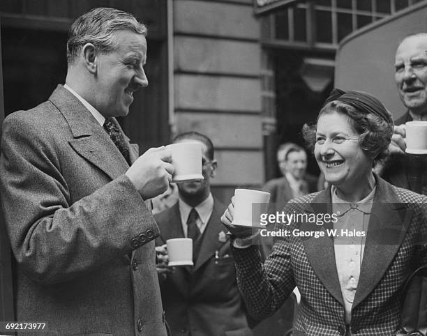 Lady Blane and Stanley Rous , secretary of the Football Association, inspect a convoy of mobile tea cars at the YMCA headquarters in London, 30th...
