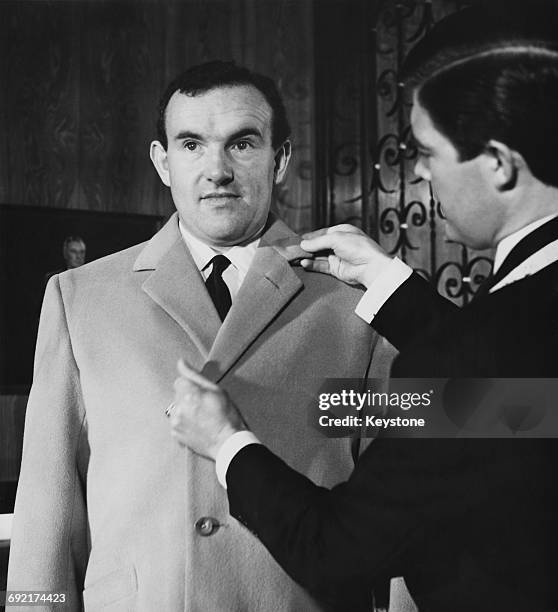 British actor Colin Blakely wearing a new Woolmark coat provided by tailors at Savile Row for the National Theatre Company's tour of Russia - London,...