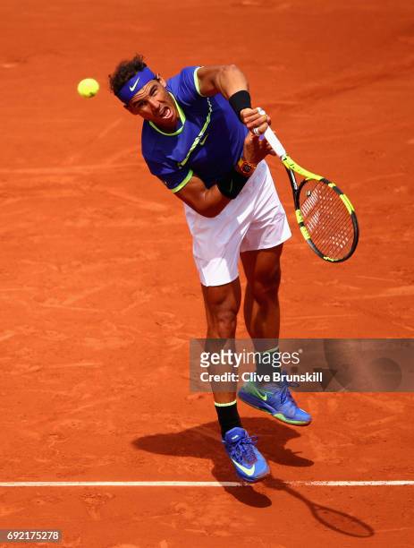Rafael Nadal of Spain serves during the mens singles fourth round match against Roberto Bautista Agut of Spain on day eight of the 2017 French Open...