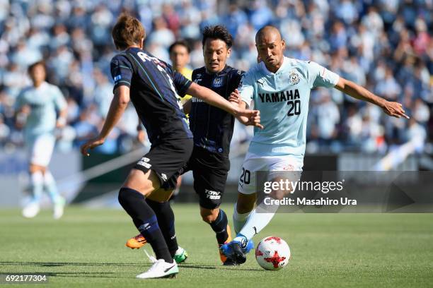 Kengo Kawamata of Jubilo Iwata and Jungo Fujimoto of Gamba Osaka compete for the ball during the J.League J1 match between Jubilo Iwata and Gamba...