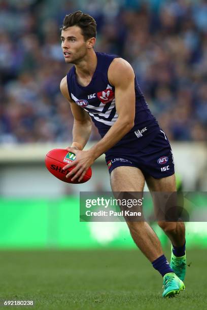 Lachie Weller of the Dockers looks to pass the ball during the round 11 AFL match between the Fremantle Dockers and the Collingwood Magpies at Domain...