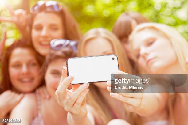 young girls taking group selfies in summer vacation - girl band stock pictures, royalty-free photos & images