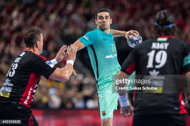 Kiril Lazarov of Barcelona is attacked by Momir Ilic of Veszprem during the VELUX EHF FINAL4 3rd place match between Telekom Veszprem and FC...