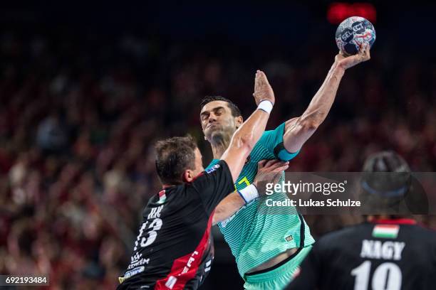 Kiril Lazarov of Barcelona is attacked by Momir Ilic of Veszprem during the VELUX EHF FINAL4 3rd place match between Telekom Veszprem and FC...