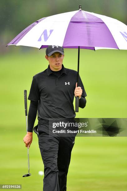 Matthew Fitzpatrick of England shelters from the rain during day four of the Nordea Masters at Barseback Golf & Country Club on June 4, 2017 in...