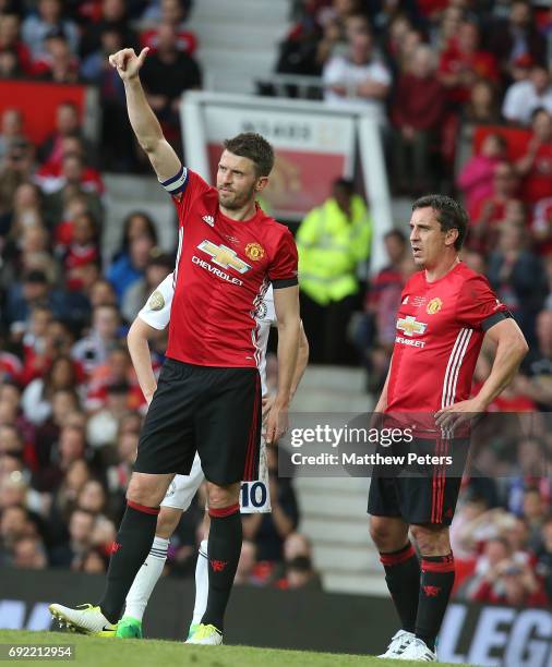 Michael Carrick and Gary Neville of Manchester United '08 XI in action during the Michael Carrick Testimonial match between Manchester United '08 XI...