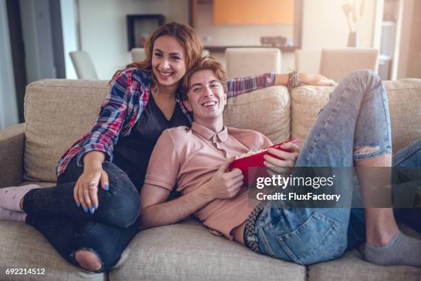 watch her favorite movie with her - the popcorn factory stock pictures, royalty-free photos & images