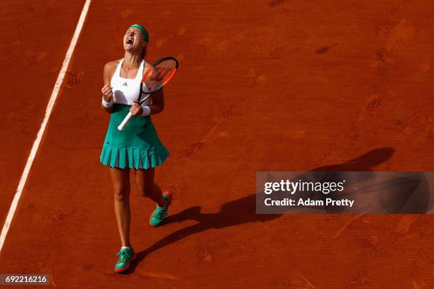 Kristina Mladenovic of France celebrates victory in the ladies singles fourth round match against Gabine Muguruza of Spain on day eight of the 2017...