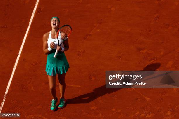 Kristina Mladenovic of France celebrates victory in the ladies singles fourth round match against Gabine Muguruza of Spain on day eight of the 2017...